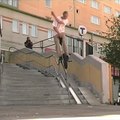 Guy Rides Unicycle Over Curved Handrail in a Street in Stockholm
