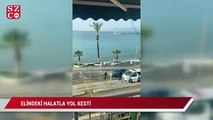 Alkollü adam elindeki halatla yol kesti