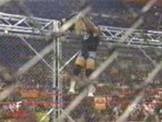 Al Snow slams Jeff Hardy off the cage onto a chair