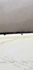 Wind Blows Ice Fishing Shanty Across Lake