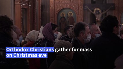 Russians attend Orthodox Christmas mass in Moscow