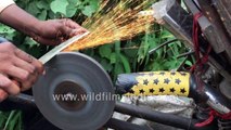 Cycle-powered knife sharpener caught in action - Sparks flying off the grindstone