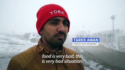 Snow falls as migrants continue to wait for shelter in Bosnia