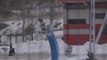 Skier Gets Stuck on Curved Basketball Pole While Attempting to Jump Over it