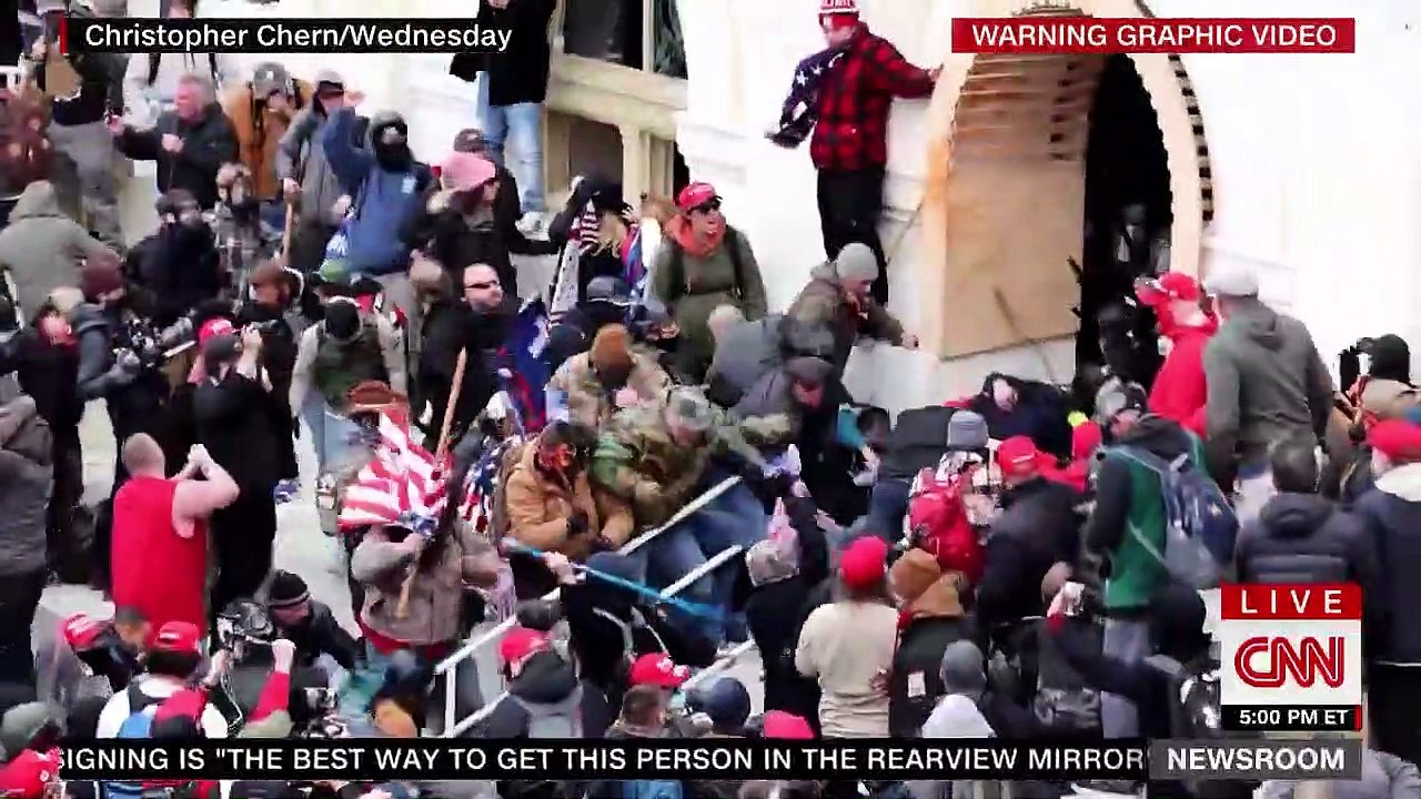 Trump supporters beat cop with American flag pole