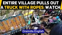 Nagaland: Entire village community pulls out a truck out of a gorge using just ropes| Oneindia News