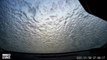 Water splashed onto car instantly freezes to windshield