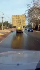 Tense Time Watching Truck with Tipping Load