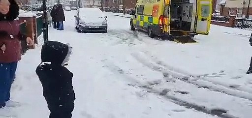 Firefighters take part in snowball fight with child in Sheffield suburb