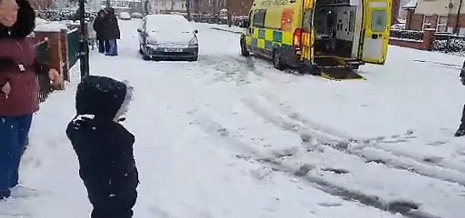Firefighters take part in snowball fight with child in Sheffield suburb