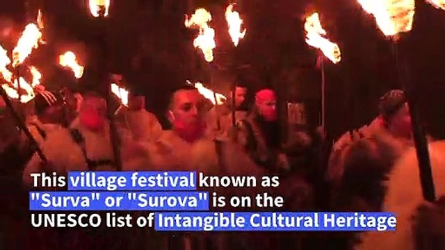 Bulgarian villagers chase away evil with bonfire feast and dancing