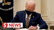 Biden signs executive orders to expand food stamps, raise federal pay