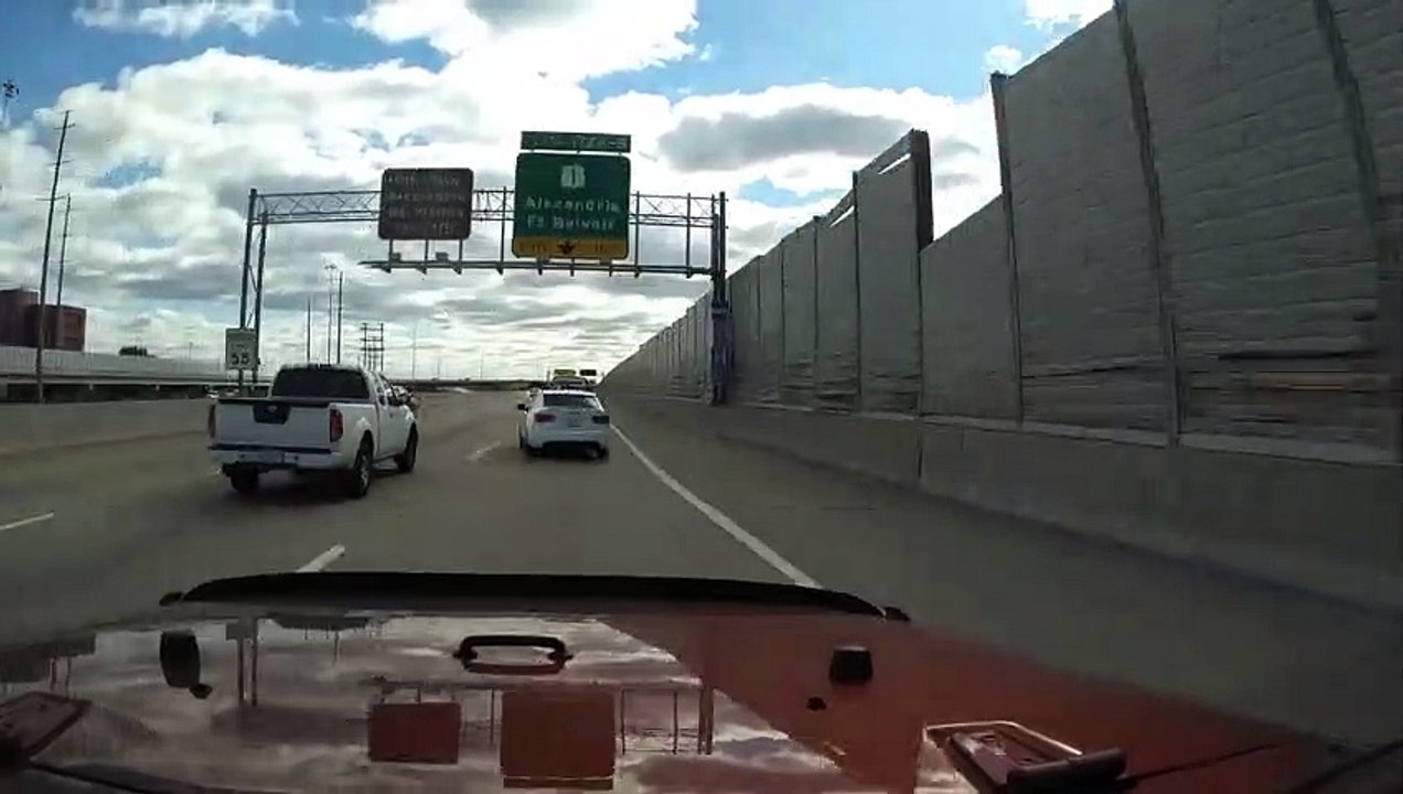 Impatient Car Swerves Through Traffic
