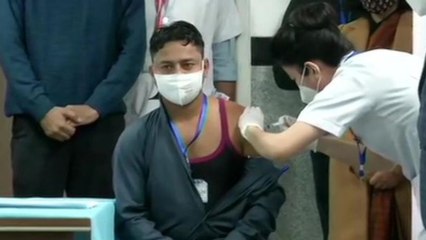AIIMS sanitation worker takes first shot of Covid Vaccine