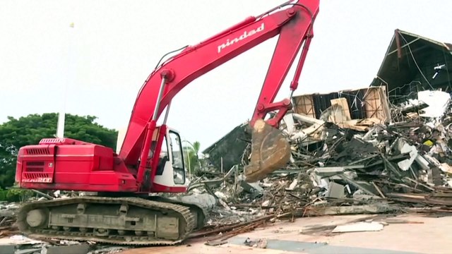 Indonesian rescuers retrieve more bodies from the rubble of buildings toppled by powerful earthquake