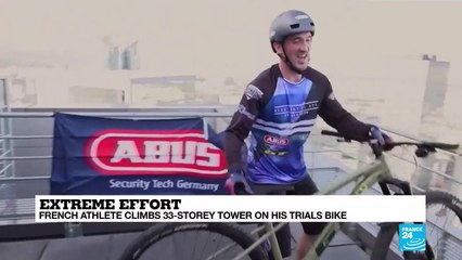 Extreme effort: French athlete climbs 33-storey tower on his bike