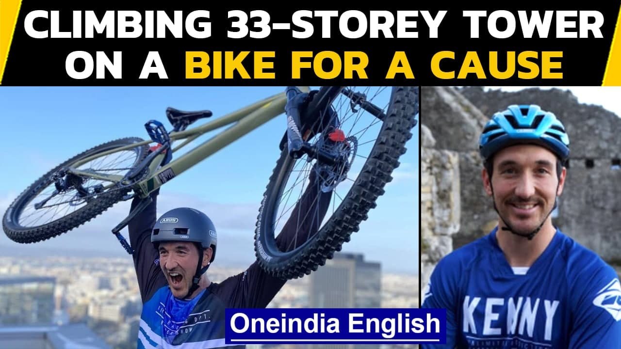 French mountain-biker rides up 33-storey tower: WATCH | Oneindia News