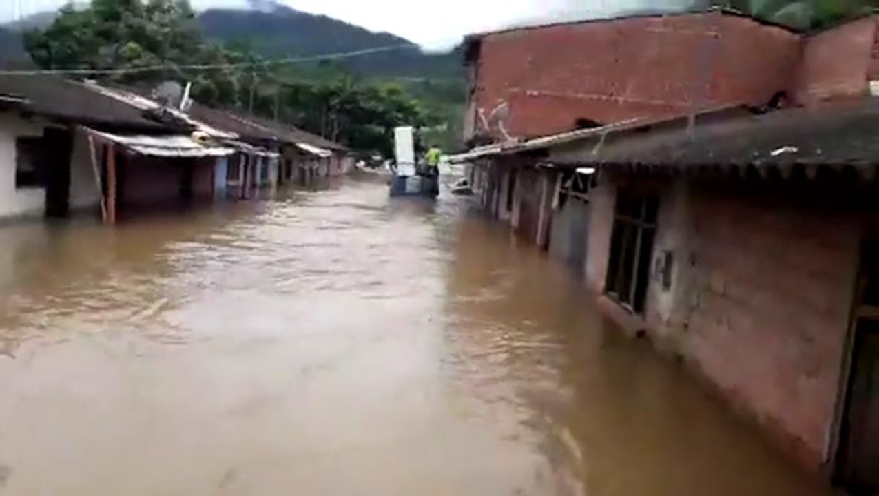 Homes swallowed by floodwaters after river overflows