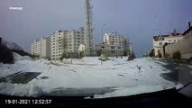 Quick Thinking Driver Reverses Away from Sliding Car