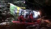 Daunting rescue of driver trapped in fast-moving river caught on video
