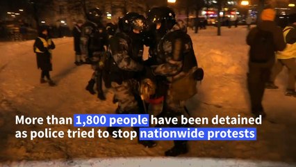 Police arrest anti-Putin protesters in the snow in Moscow