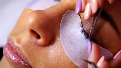 Lady Getting Her Eyelashes Done by a Professional Beautician