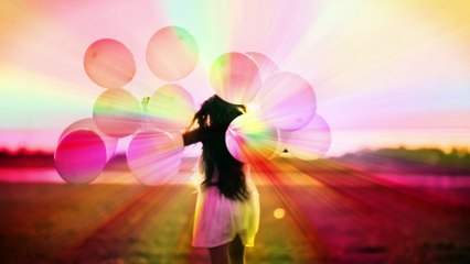 Girl Having Fun with Balloons in the Garden