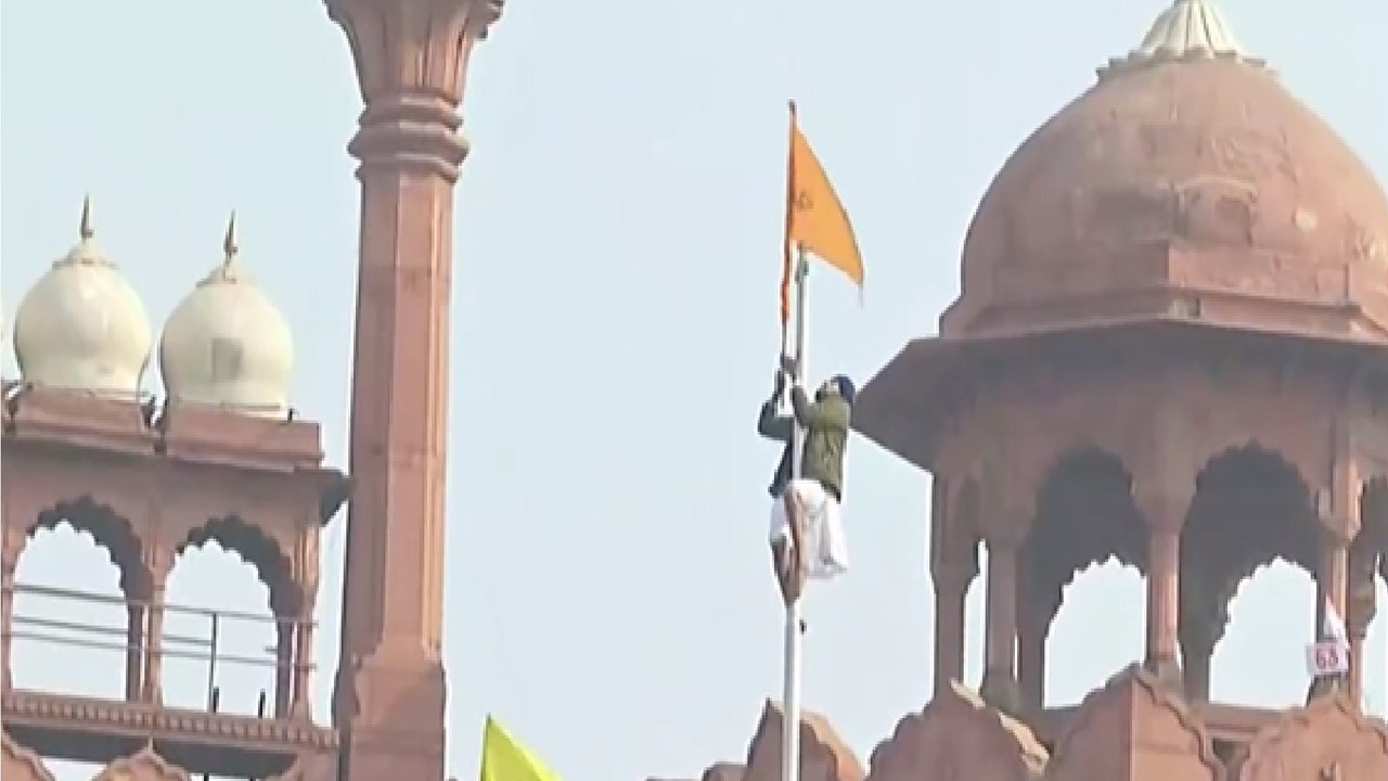 Protesters enter Red Fort, wave their flags