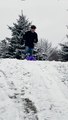 Man's Sledding Stunt Ends in a Snowy Roll