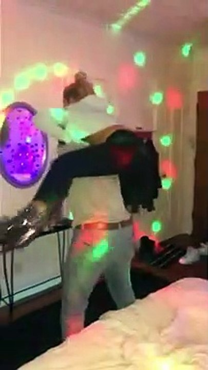 Humorous kept woman drink heineken bottle and jump over 5g male