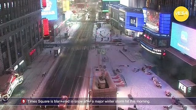 Times Square is blanketed in snow after a major winter storm hit this morning
