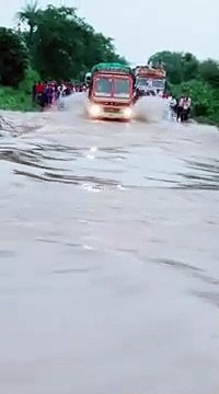 truck driving in flood water