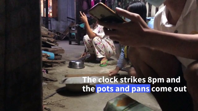 Yangon residents protest against the coup by banging pots and pans