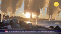 Sub-zero temperatures have frozen icicles on to the pier in Long Island, as a cold snap hits NY