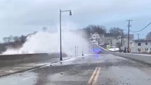 Huge waves crash over barrier