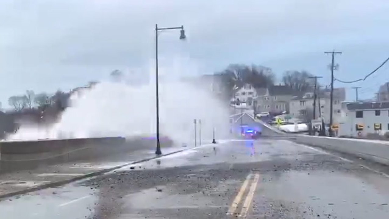 Huge waves crash over barrier