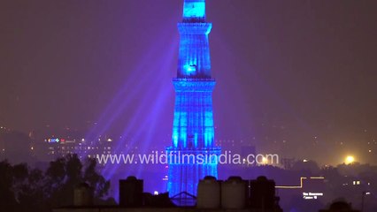 Qutub Minar lit in blue light at night _ Red to blue after sundown _ Red sandstone tower