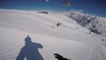 Guy Falls Hard On His Back On Landing While Skiing Down Snowy Slope