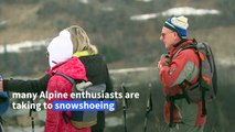 Deprived of skiing, tourists have turned to snowshoeing for mountain fun