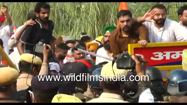 Farmers' Protest at Delhi-Haryana border _ Protestors subjected to water cannon _ Tractor in flames