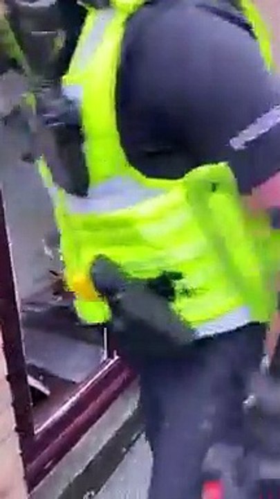 Derbyshire Police break down door in cannabis farm raid