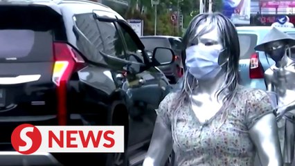 "Silver people” roaming in streets near Jakarta