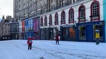 Credit: Aye Spy Photography Scotland (@AyeSpyPhotos). Woman skiing down Victoria Street in Edinburgh.