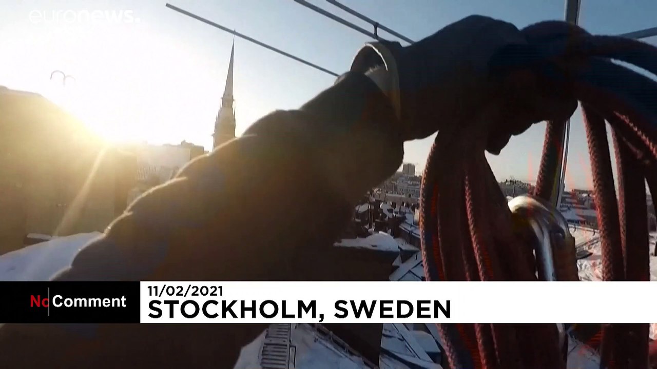 Stockholm roofers brave dizzying heights to sweep snow