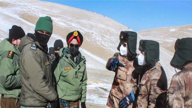 Indian-Chinese officers shake hands before disengagement