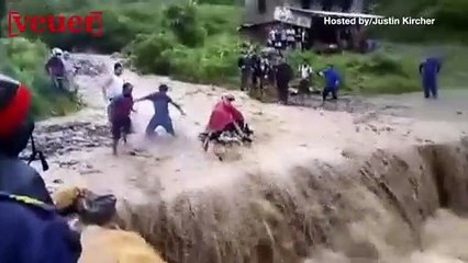 A Motorcyclist is Lucky to Be Alive After Flood Waters Swept Him Away