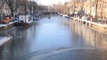 Skaters test their skills on frozen canals and ponds in the Netherlands