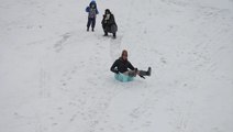Families get out in Louisville snow to enjoy sledding