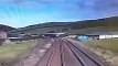 This shocking footage shows the moment an idiot driver came within seconds of being crushed by a fast-moving train after not looking both ways at a crossing