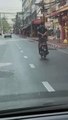 Moped Rider Coasts Down Street Using Only His Feet